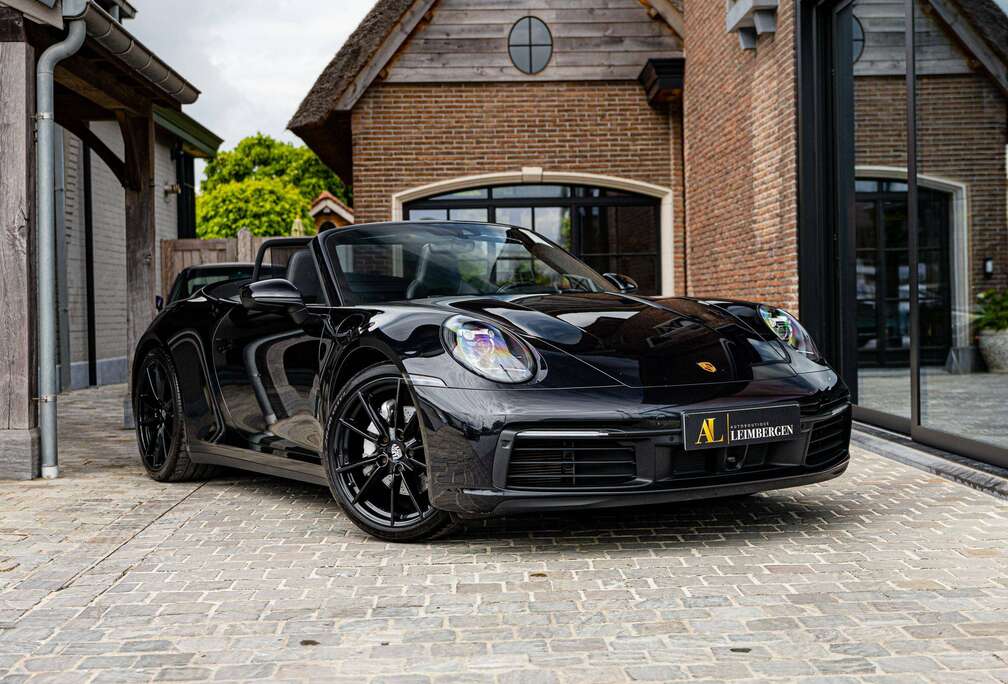 Porsche Carrera (992) Cabrio / Jet Black / Sport Exhaust / BOSE / ACC / Lane Assist / Camera / 4-way / Heated Wheel / PASM / 90L